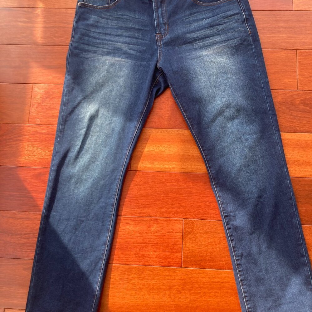 Never been worn, stretch distressed denim jeans by Genes Shop